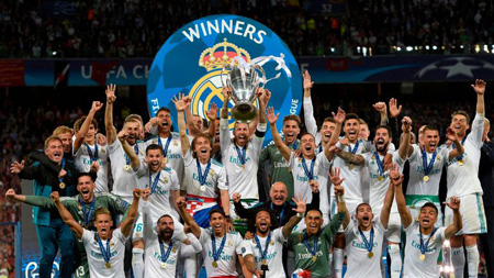 The Real Madrid team celebrate the Champions League trophy.